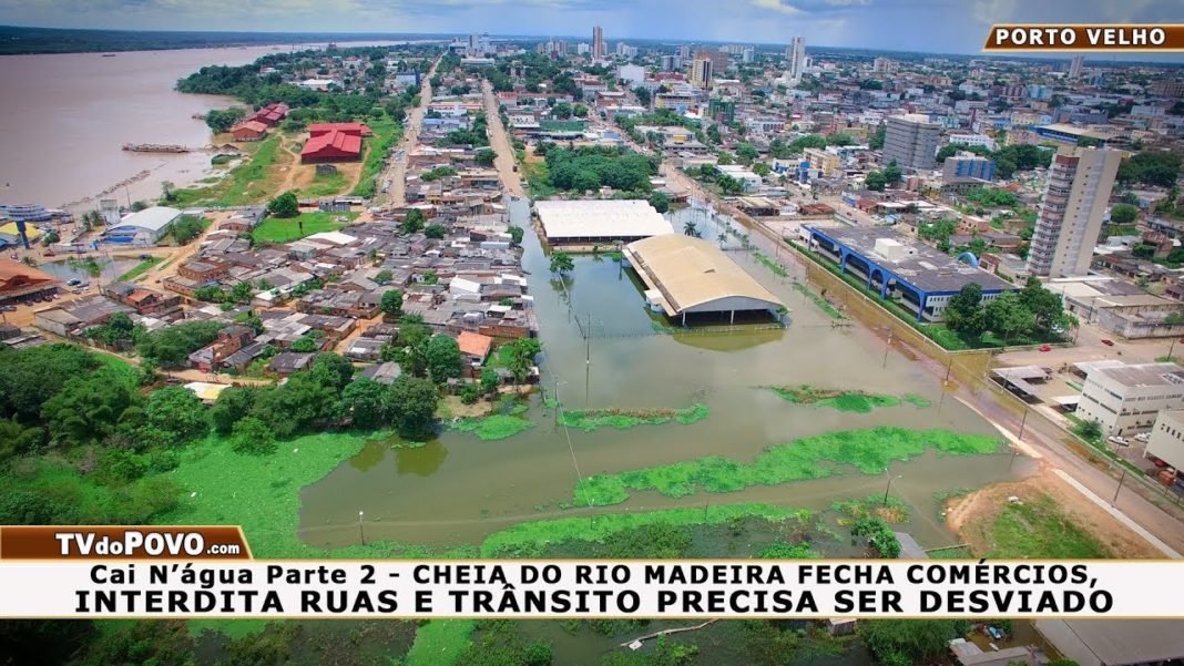 Cai N’água Vídeo 02 – Cheia do Rio Madeira Fecha Comércios, Interdita Ruas e Trânsito Precisa Ser Desviado.