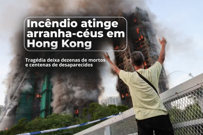 Incêndio atinge arranha-céus em Hong Kong Homem levanta os braços enquanto arranha-céus em Hong Kong são consumidos por um incêndio de grande proporção.