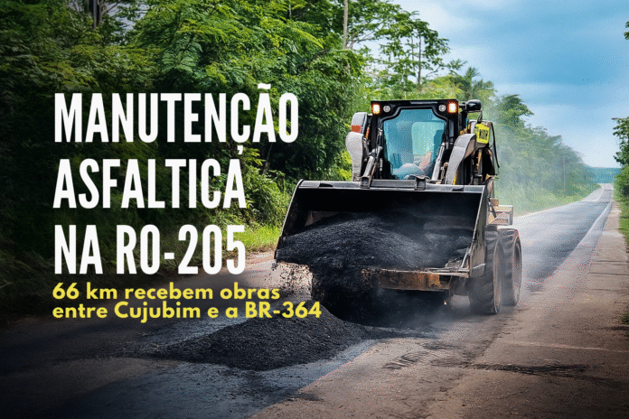 Máquina aplicando massa asfáltica durante manutenção em 66 km da RO-205, entre Cujubim e a BR-364.