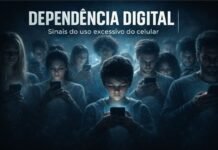 Dependência digital: sinais de alerta do uso excessivo do celular Grupo de pessoas olhando para o celular em ambiente escuro simbolizando dependência digital