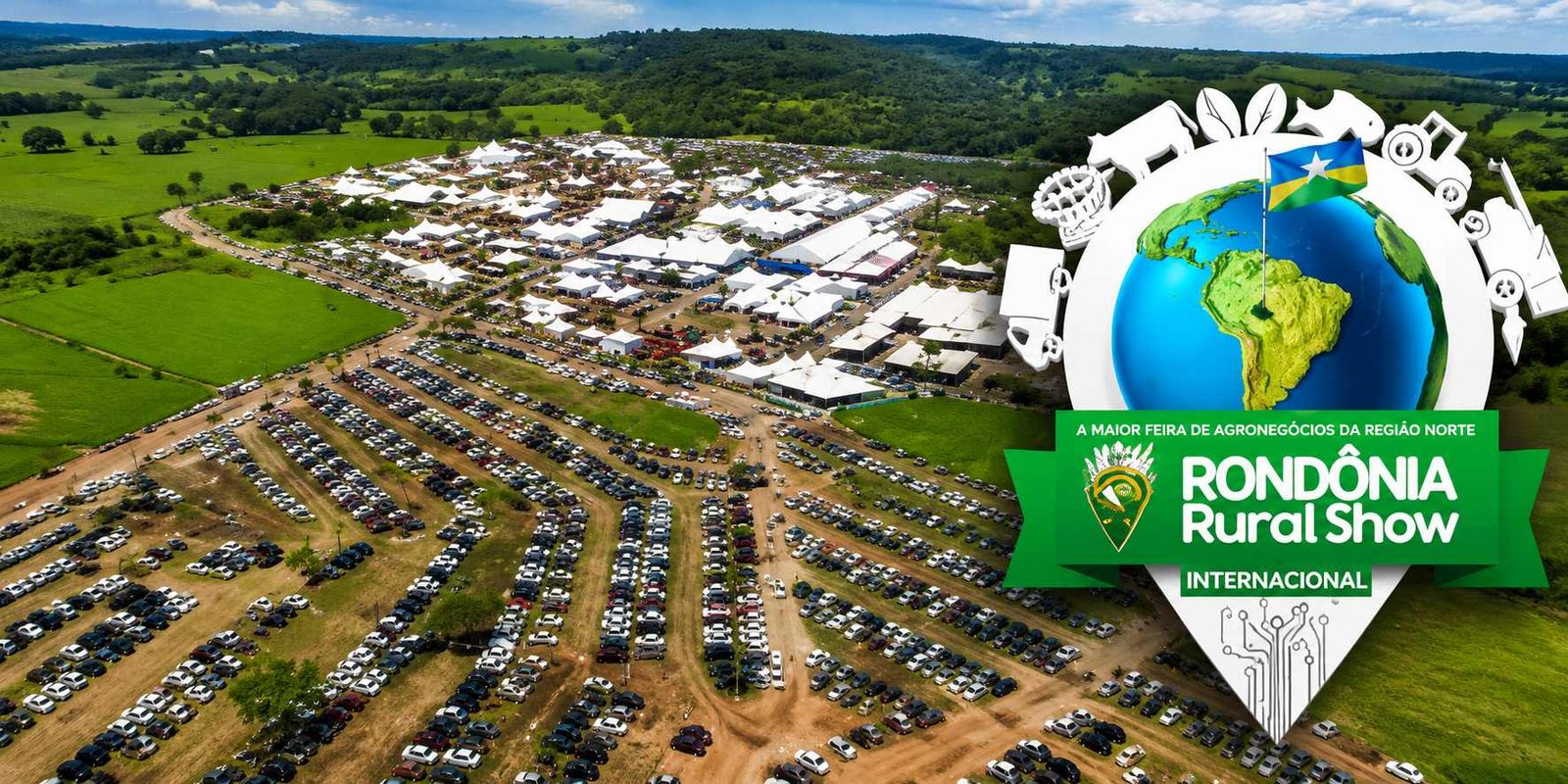 Vista aérea da Rondônia Rural Show Internacional com pavilhões, estacionamento cheio e área rural em Rondônia.